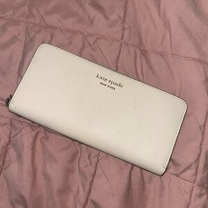 kate spade Pebbled Leather Zip Wallet in White with Gold Logo